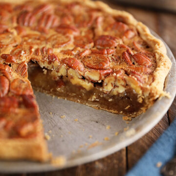 The Best Southern Pecan Pie with a slice missing