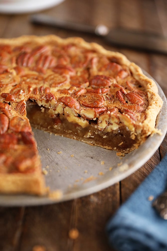 The Best Southern Pecan Pie with a slice missing