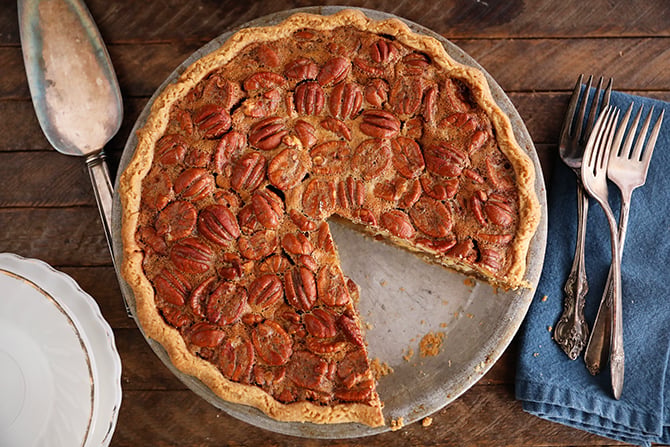 The Best Southern Pecan Pie with a slice missing