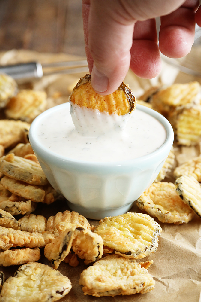 Dipping Fried Dill Pickles in sauce