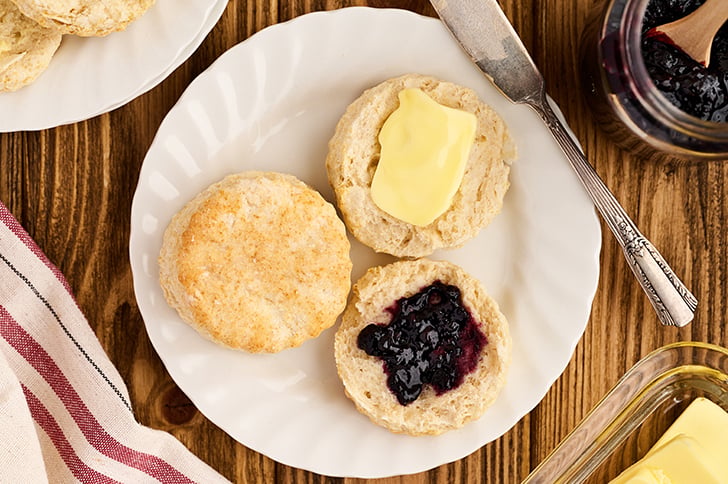 Open biscuits with butter and jam.