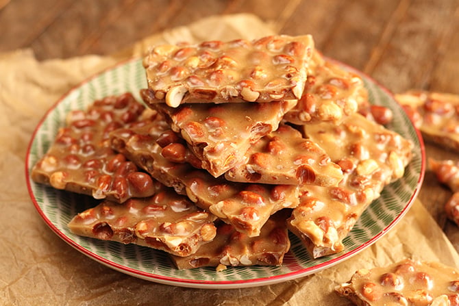 Pieces of Peanut Brittle on serving dish
