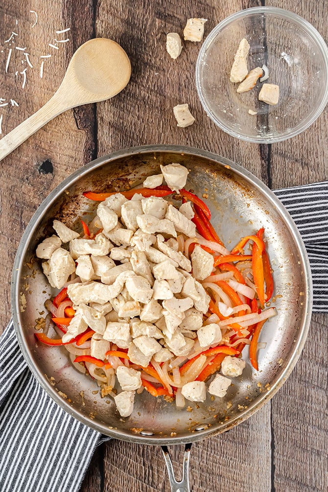 chicken and peppers in skillet