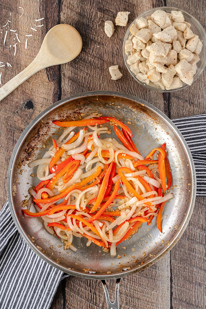 peppers and onions in skillet