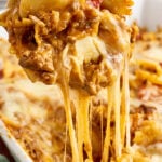 Spoonful of Cheesy Pizza Casserole with cheese pull.