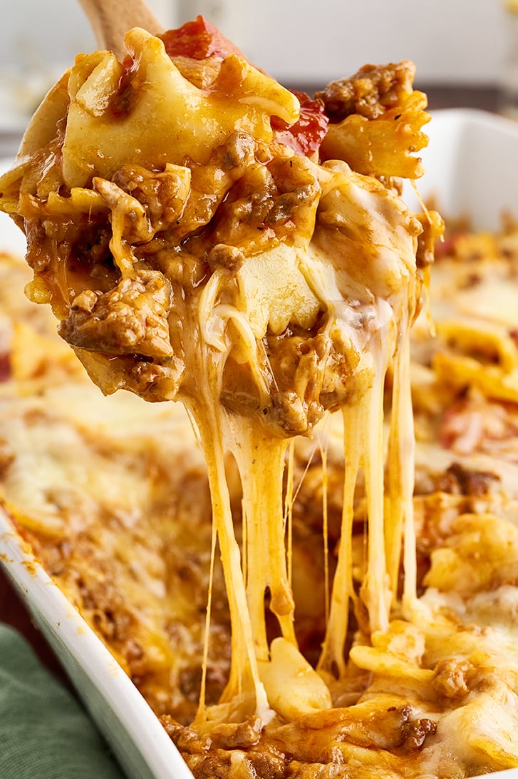 Spoonful of Cheesy Pizza Casserole with cheese pull.