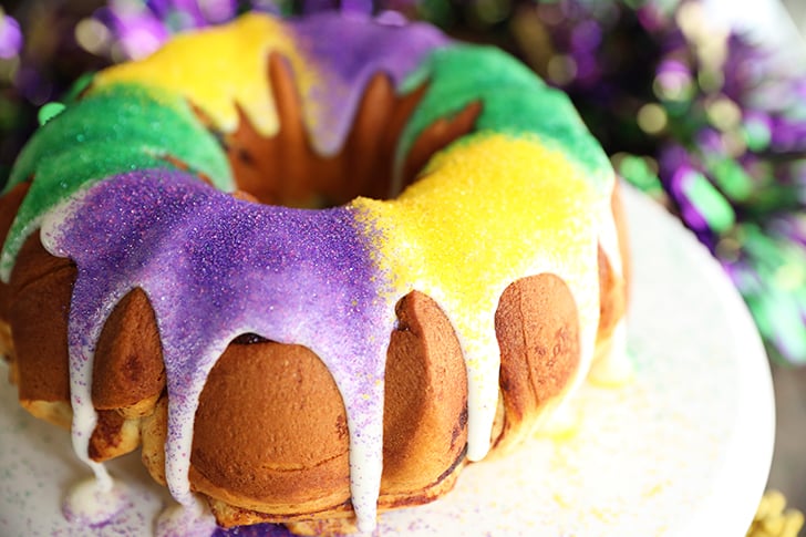 Shortcut King Cake on white cake plate.