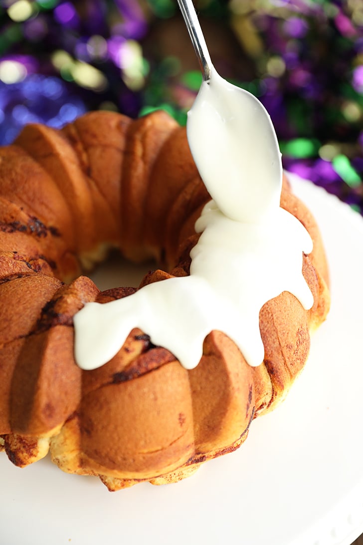 Icing being drizzled over Shortcut King Cake.