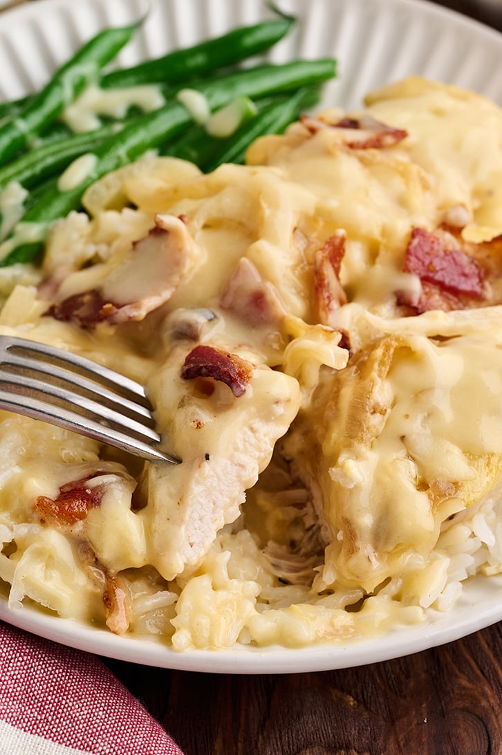 Piece of Easy Smothered Chicken on fork.