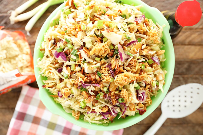 Overhead shot of Asian Inspired Ramen Slaw in a green bowl