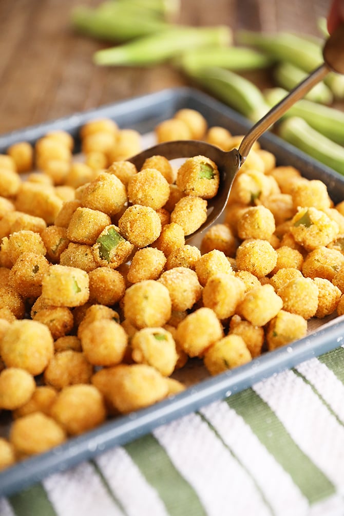 Spooning Fried Okra onto a sheet pan