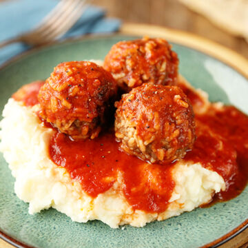 Porcupine Meatballs served over mashed potatoes
