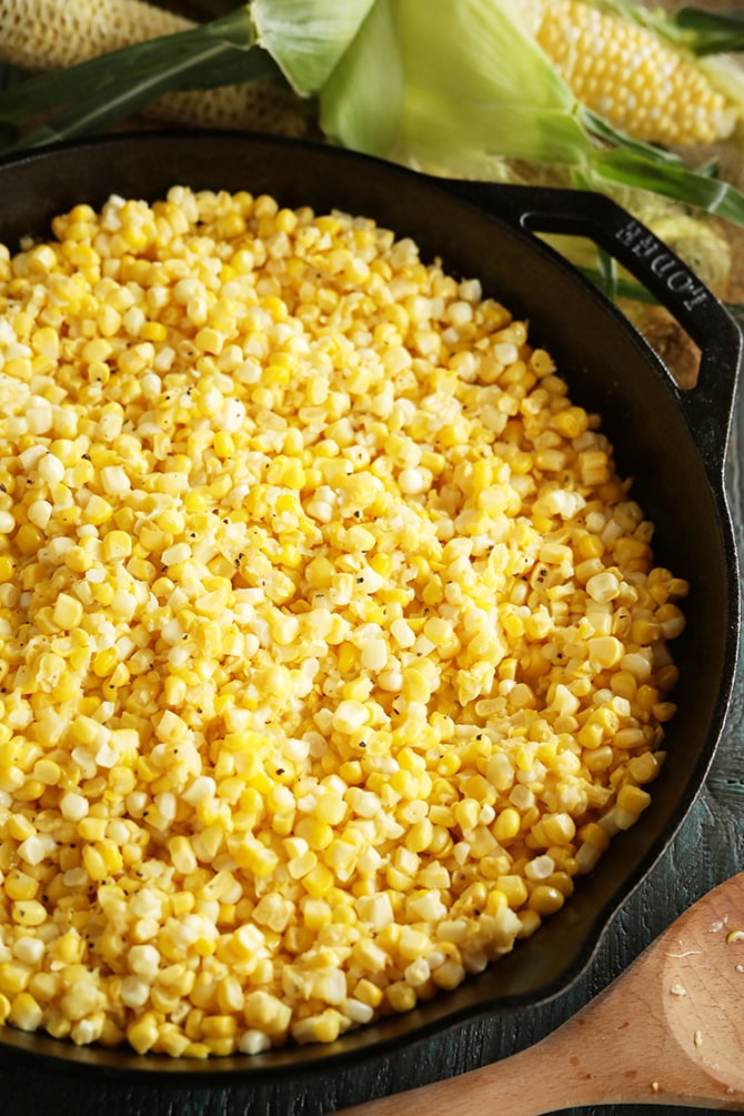Fried corn in cast iron skillet close photo