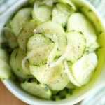 Overhead shot of Simple Cucumber and Onion Salad in a bowl.