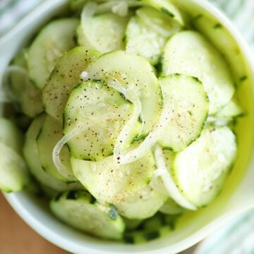Overhead shot of Simple Cucumber and Onion Salad in a bowl.