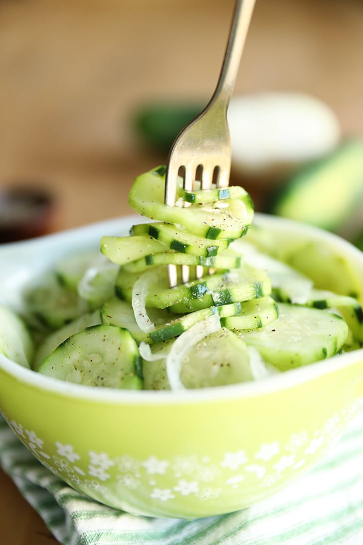 Simple Cucumber and Onion Salad in a bowl on a fork.
