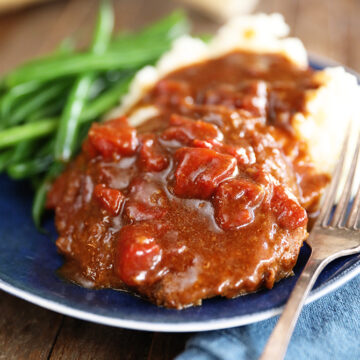 Easy Swiss Steak on plate with mashed potatoes