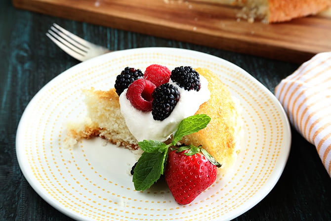 Skillet Cake with whipped topping and fruit on top