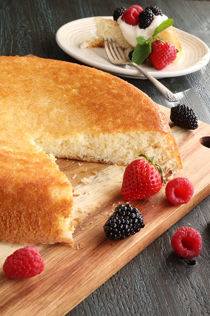 Skillet Cake Slice missing with fruit on side