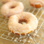 Glazed doughnut on rack.