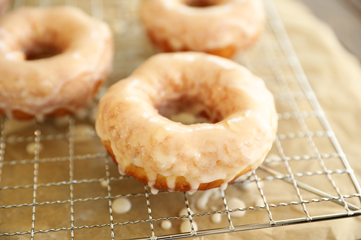 Glazed doughnut on rack.