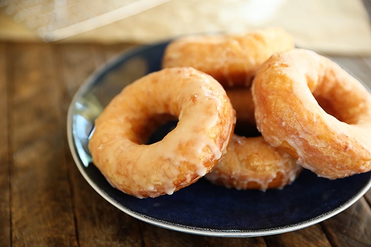 Glazed doughnut on plate.
