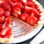 Strawberry pie with piece missing