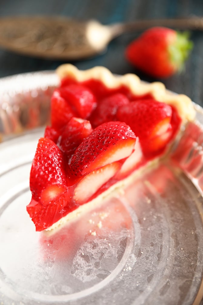 Slice of strawberry pie in baking pan