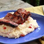 Plate of Grilled Sausage with Pimiento Cheese Grits