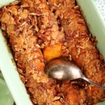 Dish of Candied Sweet Potatoes with Brown Sugar and Pecans