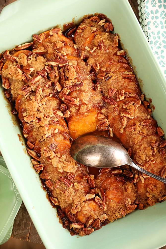 Dish of Candied Sweet Potatoes with Brown Sugar and Pecans