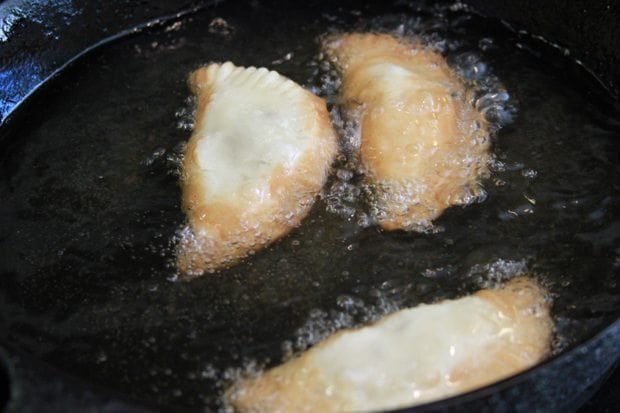Pies frying in oil