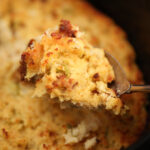 Scoop of Slow Cooker Cornbread Dressing
