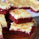 Slices of red Velvet Gooey Butter Cake stacked
