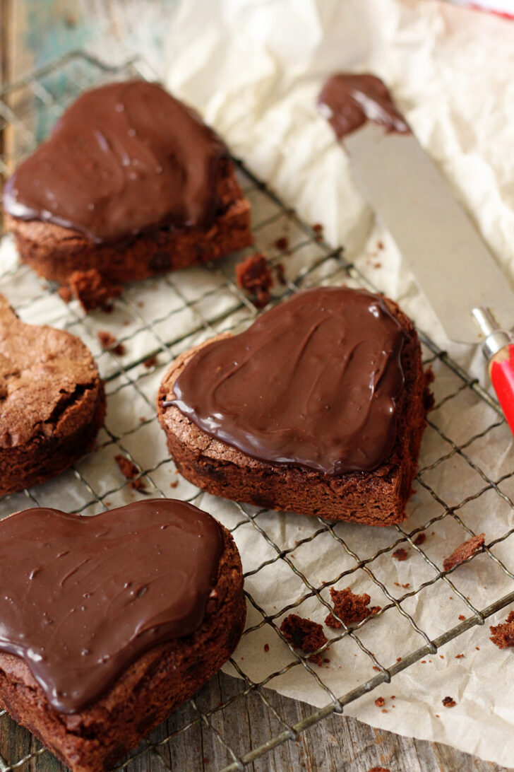 Heart-shaped brownies with chocolate ganache frosting.