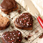 Heart-shaped brownies with chocolate ganache frosting.