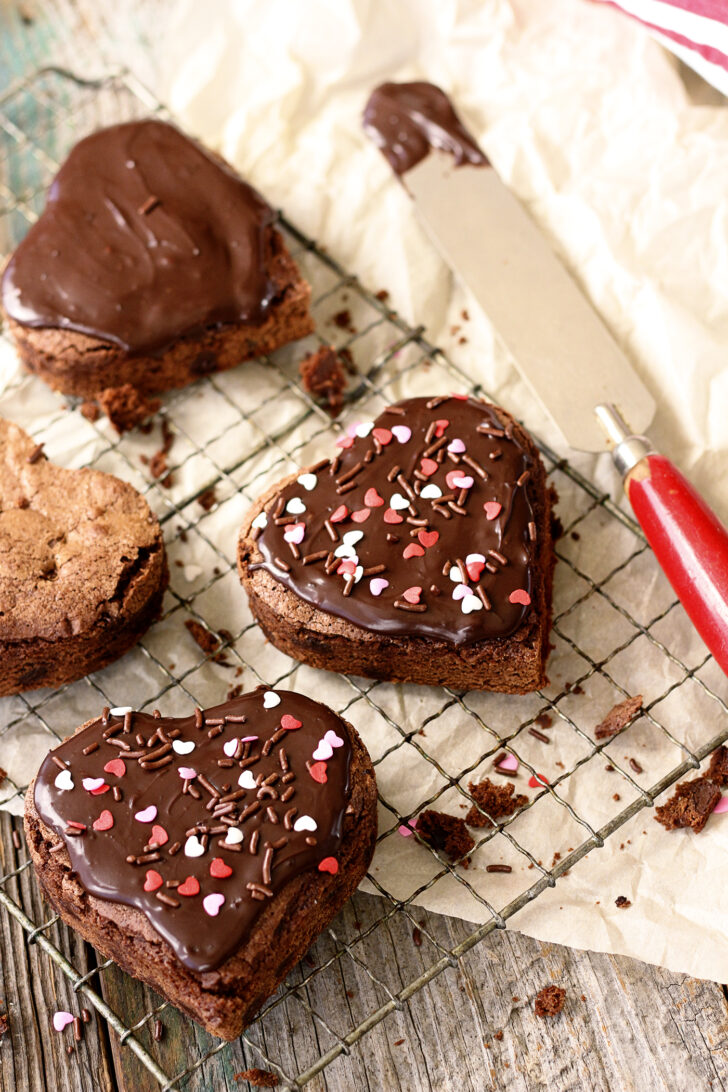 Heart-shaped brownies with chocolate ganache frosting.
