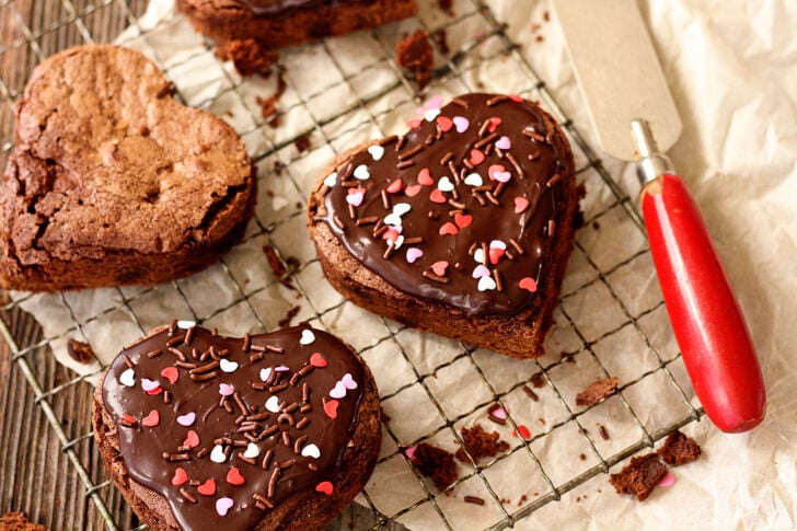 Heart-shaped brownies with chocolate ganache frosting.