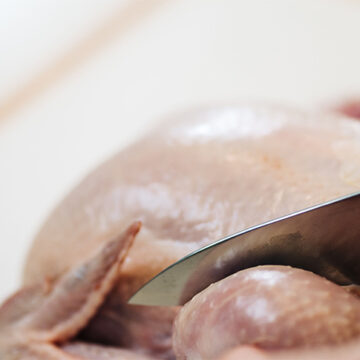 Cutting chicken.