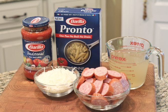 This One-Pot Cheesy Sausage Skillet only calls for 6 ingredients and is ready in no-time flat! It's perfect for a super-easy weeknight meal! 
