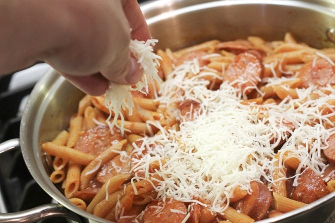 This One-Pot Cheesy Sausage Skillet only calls for 6 ingredients and is ready in no-time flat! It's perfect for a super-easy weeknight meal! 