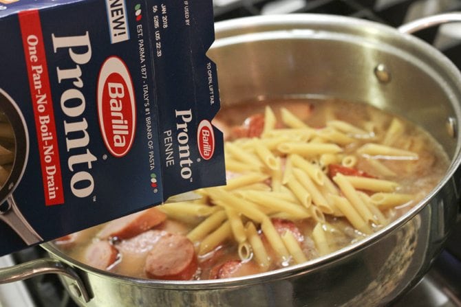 This One-Pot Cheesy Sausage Skillet only calls for 6 ingredients and is ready in no-time flat! It's perfect for a super-easy weeknight meal! 