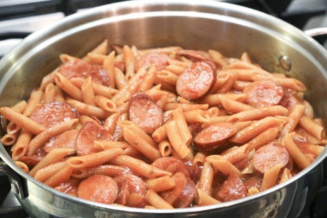 This One-Pot Cheesy Sausage Skillet only calls for 6 ingredients and is ready in no-time flat! It's perfect for a super-easy weeknight meal! 