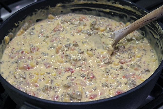 This dreamy Cheesy Sausage Dip is perfect for game day or any day! There's a stovetop and slow cooker version! 