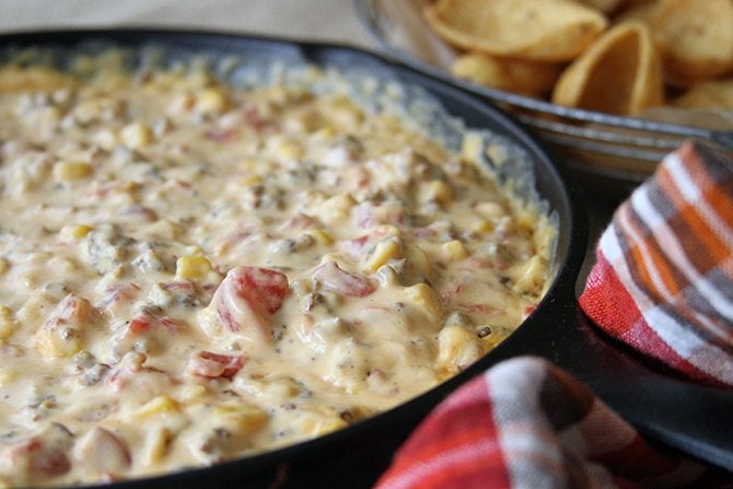 This dreamy Cheesy Sausage Dip is perfect for game day or any day! There's a stovetop and slow cooker version! 