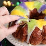 Taking a pinch of King Cake Pull Apart with fingers
