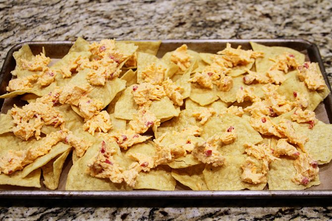 These Southern Sheet Pan Nachos combine smoky pulled pork, melty pimiento cheese, and all your favorite toppings into one amazing pan of food!