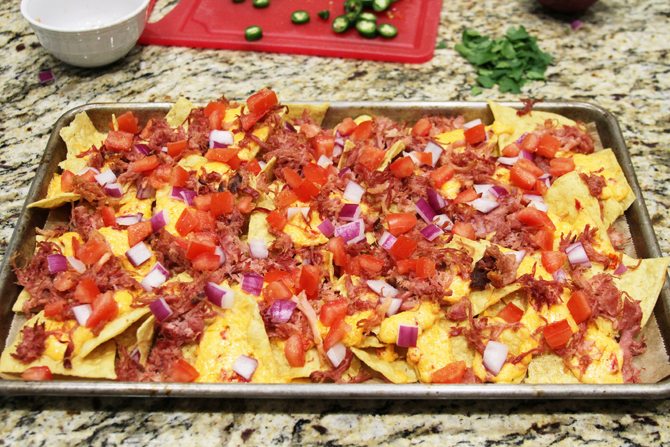 These Southern Sheet Pan Nachos combine smoky pulled pork, melty pimiento cheese, and all your favorite toppings into one amazing pan of food!