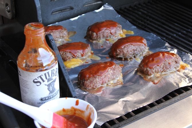 Turn your meatloaf on it's head by making it mini, grilling it, covering it with barbecue sauce, and stuffing it with cheese!