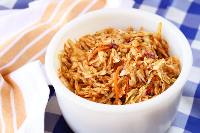 Give your taste buds a kick with this BBQ Cole Slaw - it has tangy bbq sauce as the base for the dressing! 